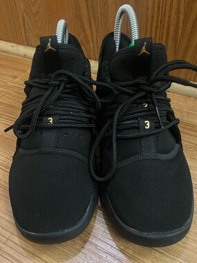 Nike Black Low-Top Athletic Sneakers with Gold Jumpman
